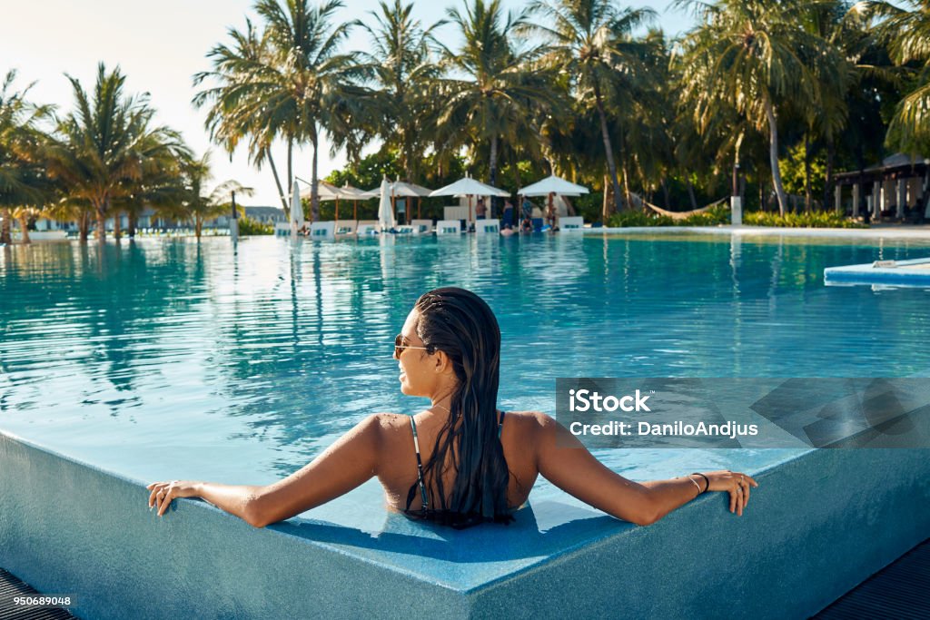enjoying at the pool total relaxation on vacation Swimming Pool Stock Photo