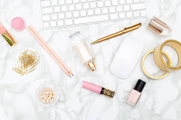 istock White keyboard and female accessories on a marble background. Flat lay 950693230