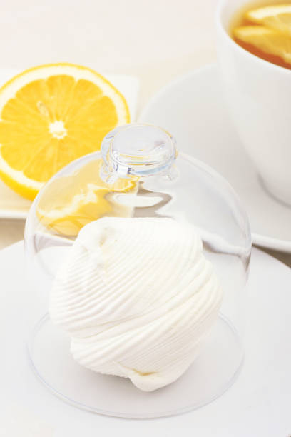 istock A cup of tea with lemon slices and zephyr. 950693594