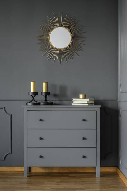 istock Cupboard with candles and books 950694042
