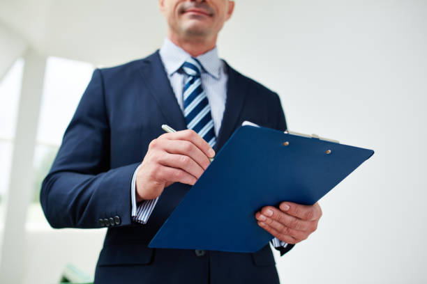 istock Businessman holding clipboard 950694426
