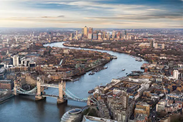 View over London: from the Tower Bridge along the Thames to Canary Wharf during sunset time