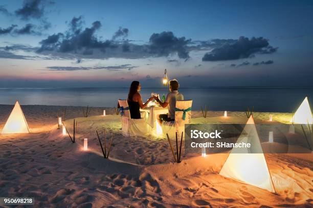 Honeymoon Couple Is Having A Private Romantic Dinner Stock Photo - Download Image Now