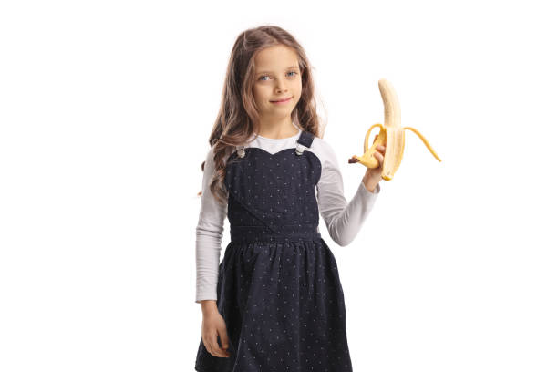 istock Little girl holding a banana 950698302