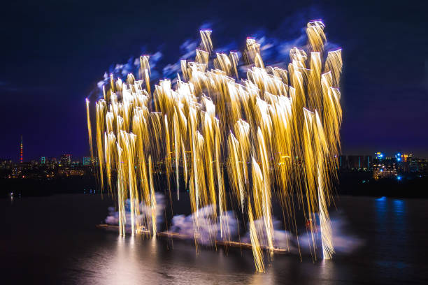 istock Golden fireworks display above the water 950702002