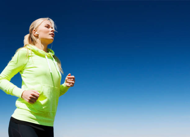 istock woman doing running outdoors 950702532