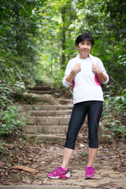 istock Asian woman hiking in jungle 950702840