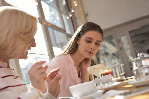 istock Content girl having lunch with her granny 950706198