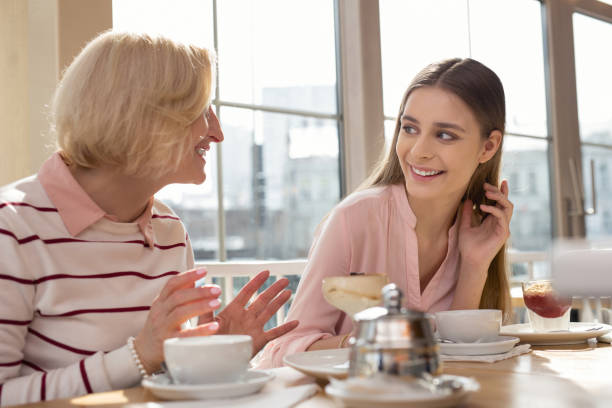 istock Joyful girl having lunch with her granny 950706286