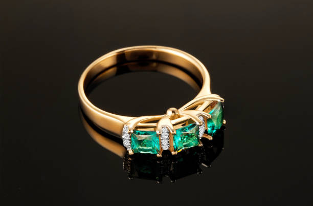 istock Ring of gold with diamonds and emeralds 950708350