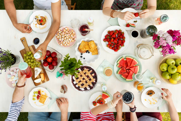 istock Group of friends sharing meal 950710638