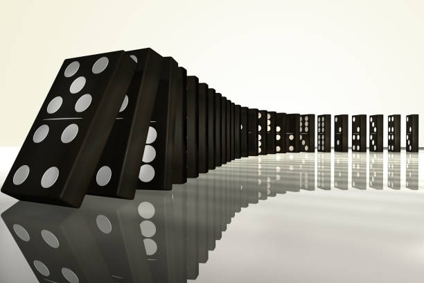istock a row of falling dominoes 950712284