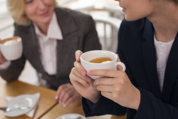 istock Determined businesswomen drinking hot aroma coffee 950712908