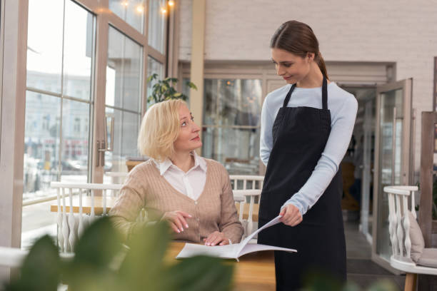 istock Delighted woman making an order 950713526
