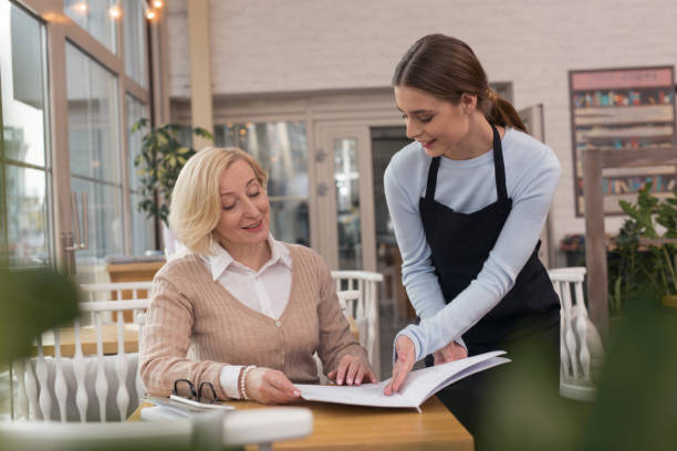 istock Smiling woman making an order 950713614