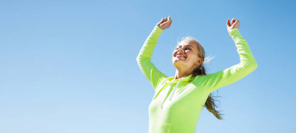 istock woman runner celebrating victory 950713938
