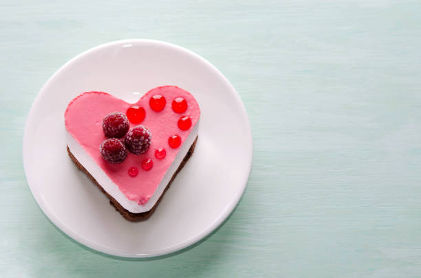 istock nice small cake in the form of heart  on the table 950722600