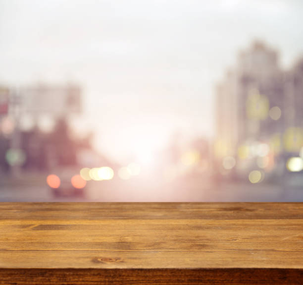 istock defocused city lights and wooden background 950734410