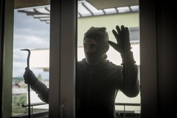 istock Burglar Breaking Into House 950738590