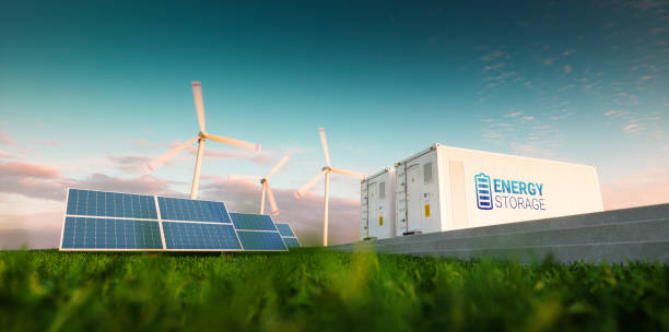 concepto de sistema de almacenamiento de energía. energías renovables - energía solar fotovoltaica, aerogeneradores y contenedor de batería de li-ion en la naturaleza fresca de la mañana. render 3d. - ion fotografías e imágenes de stock