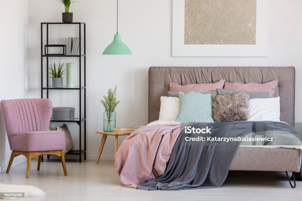 Feminine bedroom with white walls Pastel feminine bedroom interior with white walls and a mix of modern and retro design Pale Pink Stock Photo