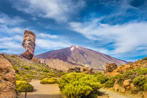 Photo of Pico del Teide with famous Roque Cinchado rock formation, Tenerife, Canary Islands, Spain