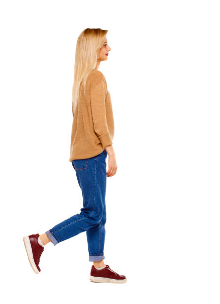istock side view of walking woman. 950744392
