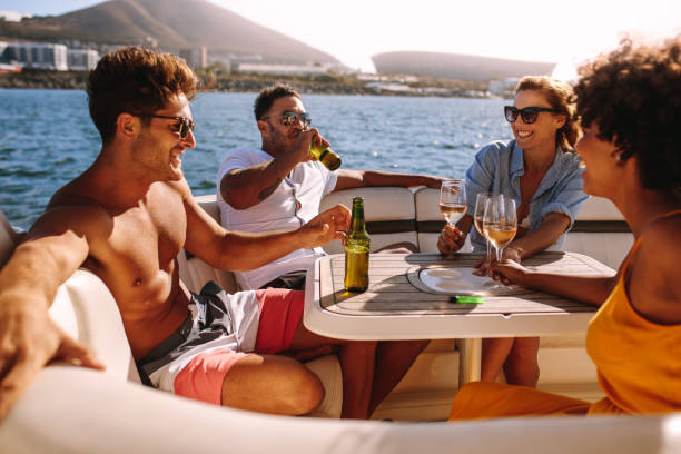 istock Happy friends having boat party 950747222