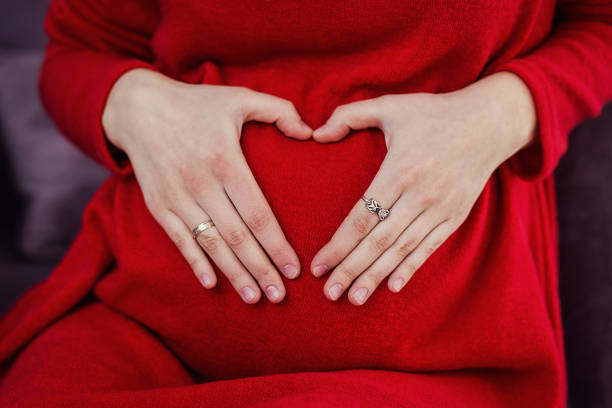 istock pregnant woman hugs her belly 950749062