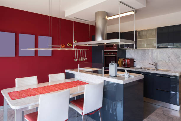 istock Modern kitchen with island, marble table and leather chairs 950749690