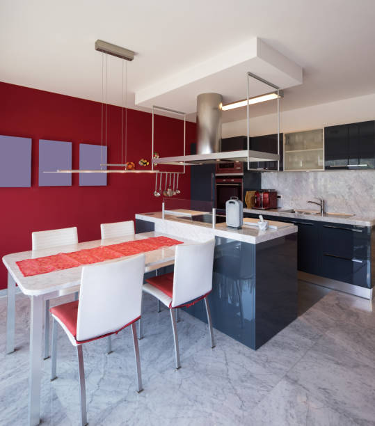 istock Modern kitchen with island, marble table and leather chairs 950749842