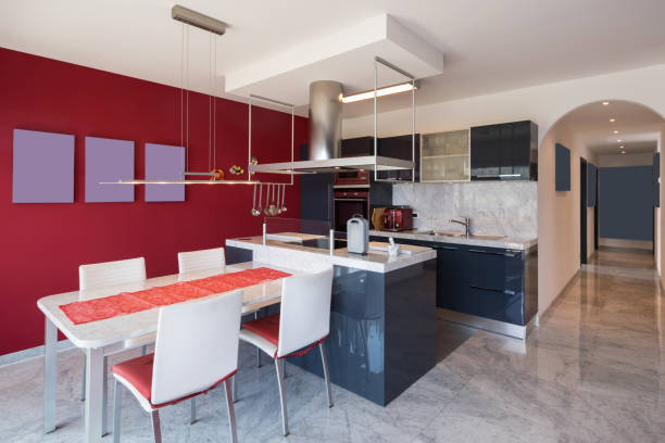 istock Modern kitchen with island, marble table and leather chairs 950750004