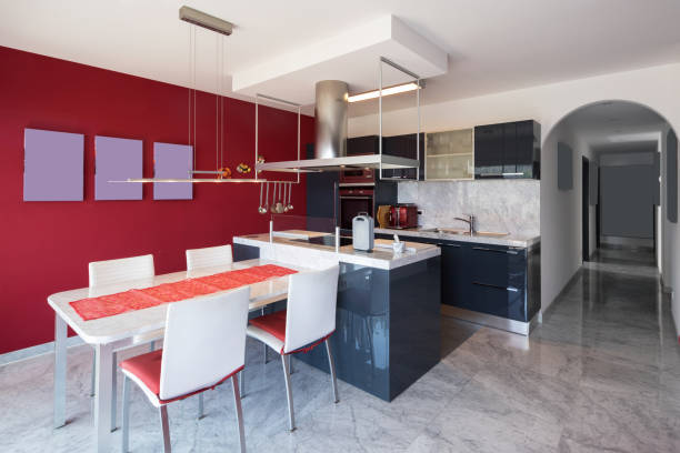 istock Modern kitchen with island, marble table and leather chairs 950752368