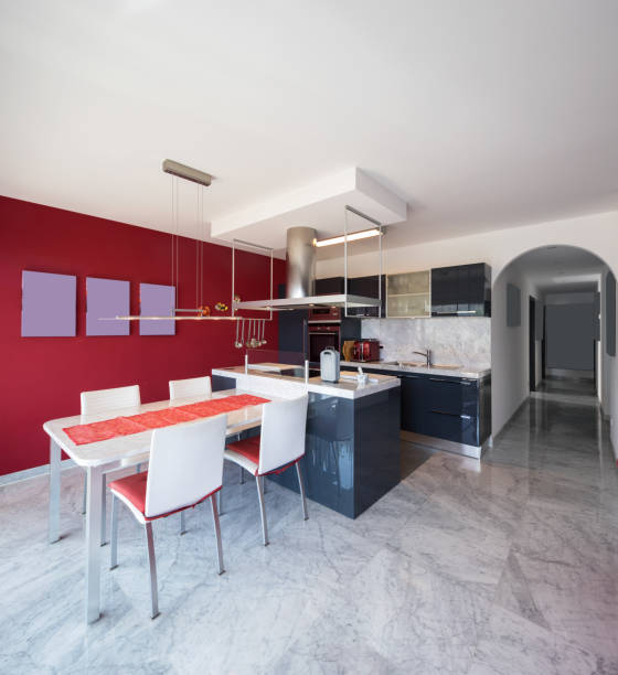 istock Modern kitchen with island, marble table and leather chairs 950752508