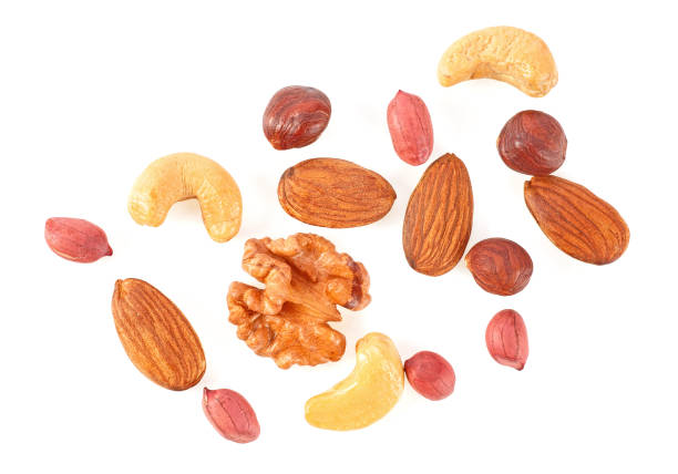 istock Mix of different nuts isolated on a white background 950757766