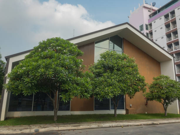 The front of the building with trees.