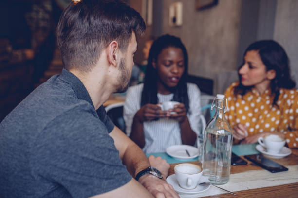 istock Friends sitting in cafe 950761334