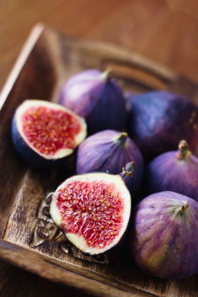 istock Ripe figs in wooden bowl 950761962