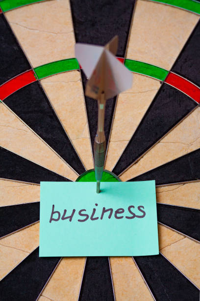 istock Dart hit the centre of target and attaches sticker 950763394