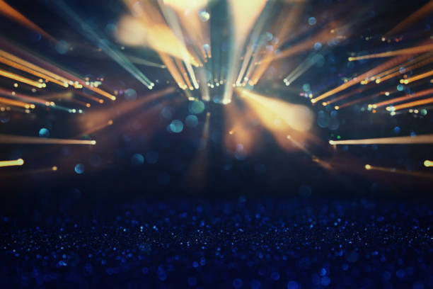 istock glitter vintage lights background. gold light burst. defocused. 950767252
