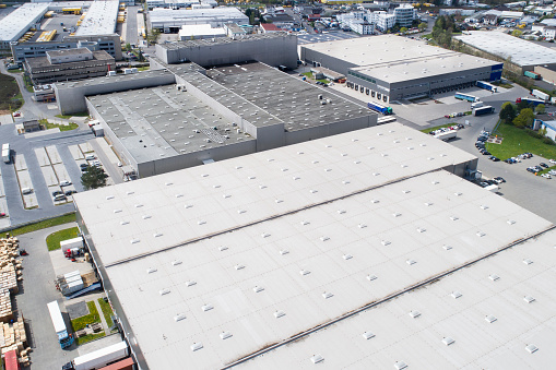 Aerial view of industrial district, large factory and distribution buildings