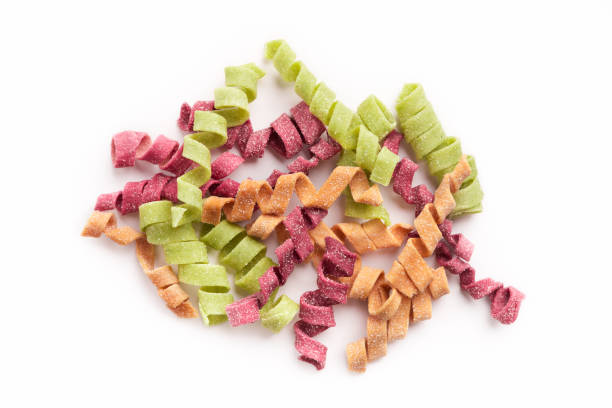 istock Mixture of colorful fusilli isolated on white 950772734