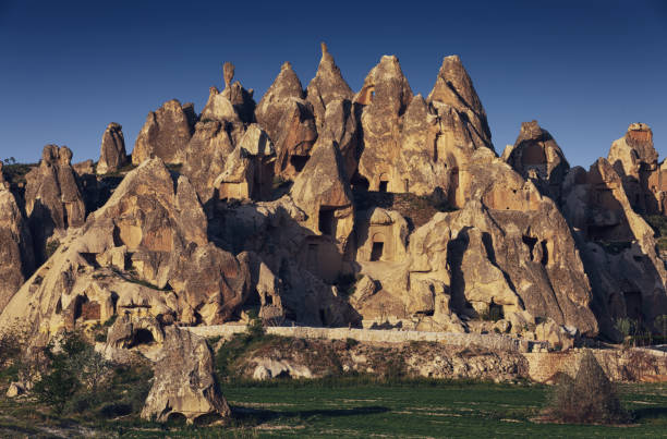 Cappadocia, a semi-arid region in central Turkey, is known for its distinctive fairy chimneys, tall, cone-shaped rock formations clustered in Monks Valley, Göreme and elsewhere.