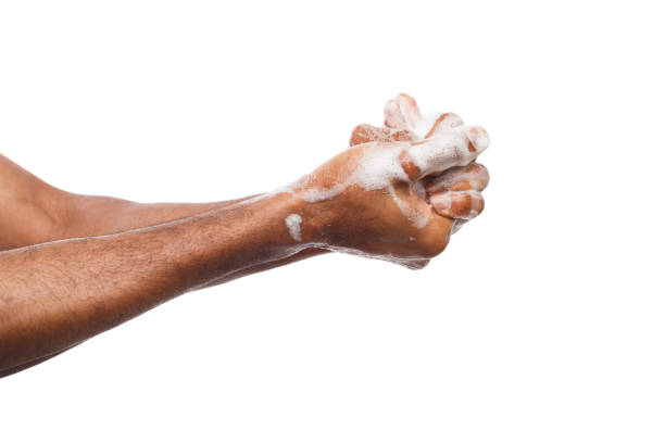 istock Black man washing hands isolated on white background 950777728