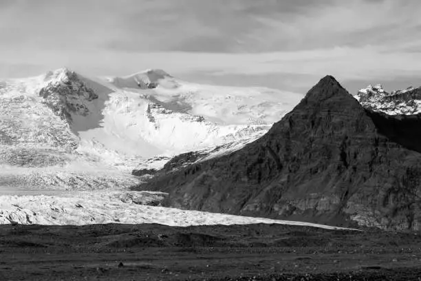 Photo of Stunning Vatnajokull glacier and mountains in black and white in Iceland