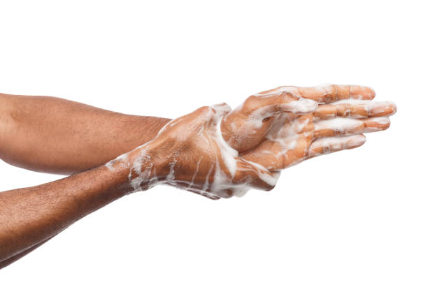 istock Black man washing hands isolated on white background 950777792