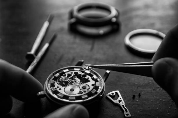 istock Watchmaker is repairing the mechanical watches in his workshop 950778310