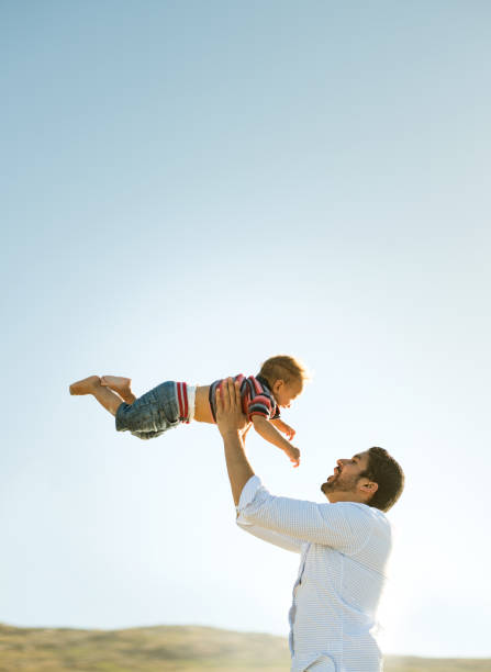 istock Father and son having fun outdoors 950778438