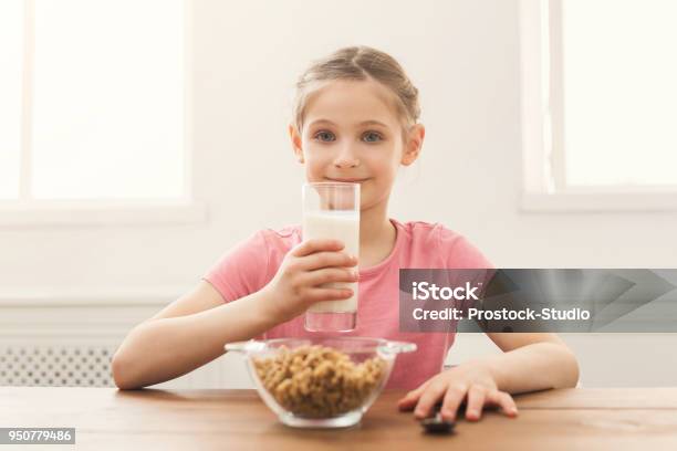 Happy Child Girl Drinking Milk Stock Photo - Download Image Now - Beauty, Breakfast, Breakfast Cereal