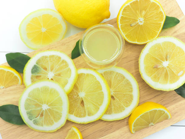 istock Fresh lemon slice with lemonade on white wood background 950779802